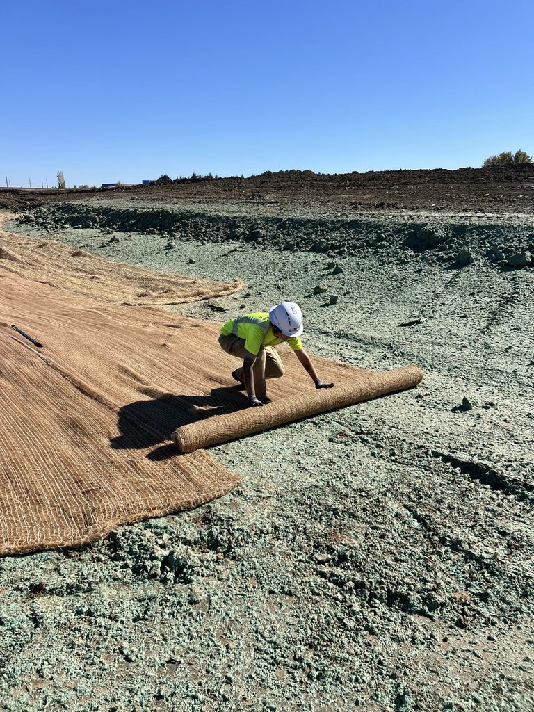 Riparia Environmental used hydroseeding, straw blankets, and jute matting to stabilize a swale